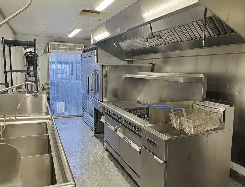 Stainless steel cooking line inside a mobile commercial kitchen