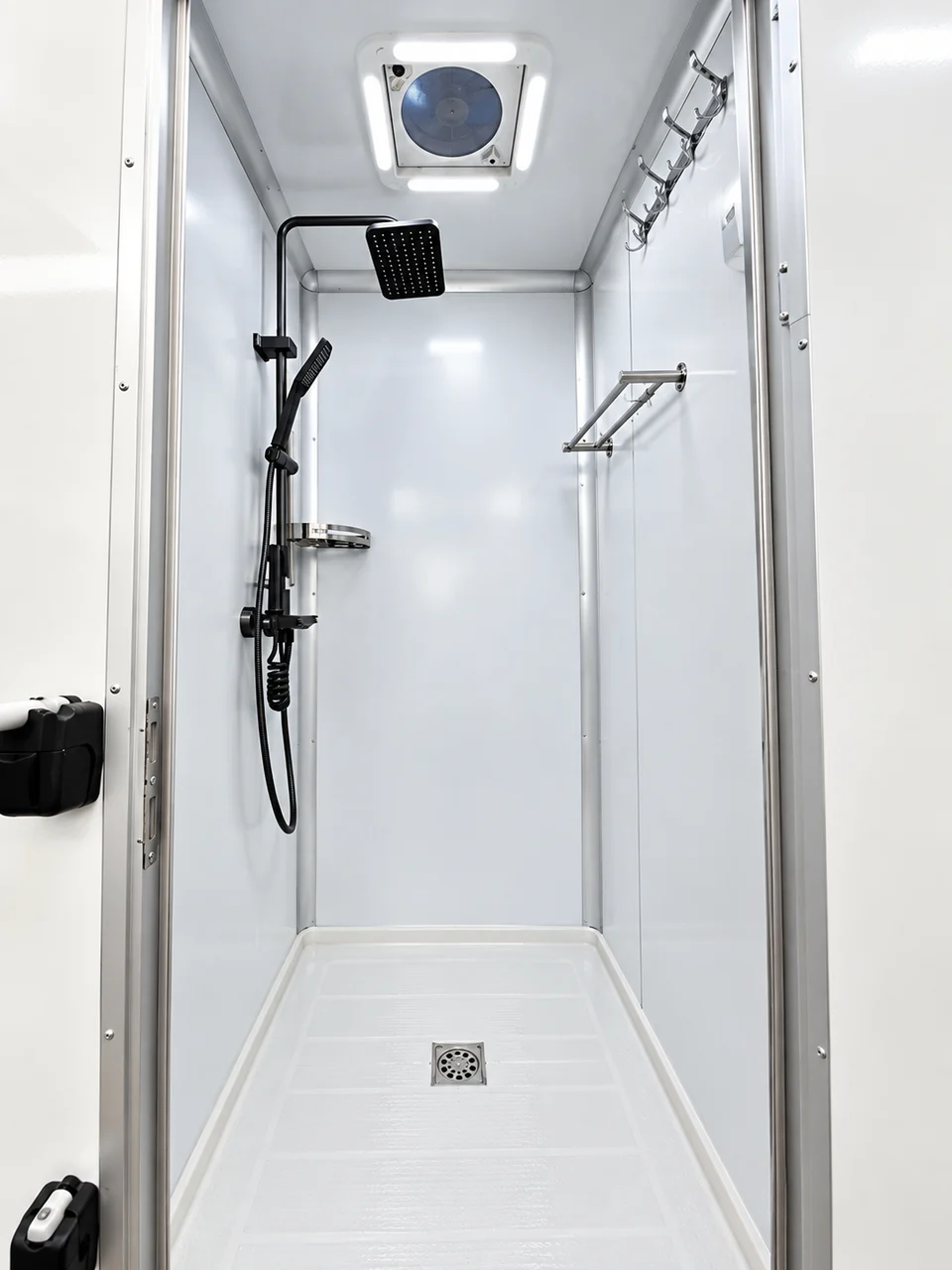 Private shower stall inside a mobile shower trailer rental